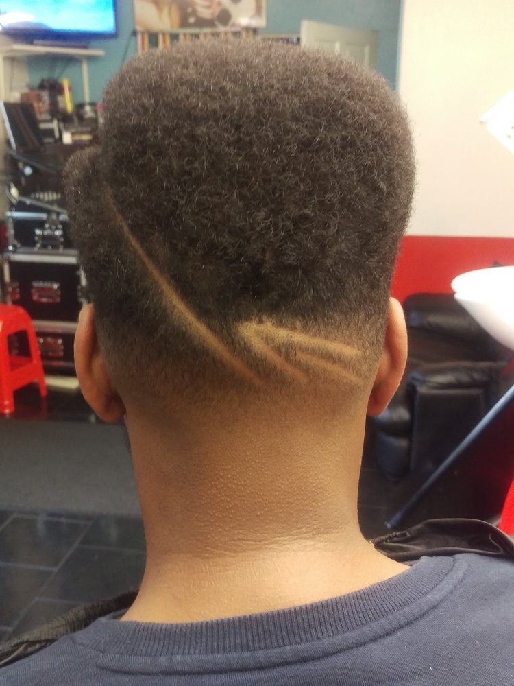 Freehand back design haircut at Otis Barbers