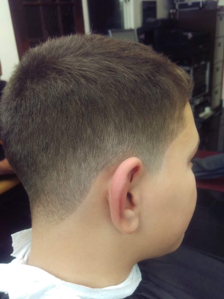Clean taper fade cut at Otis Barbers